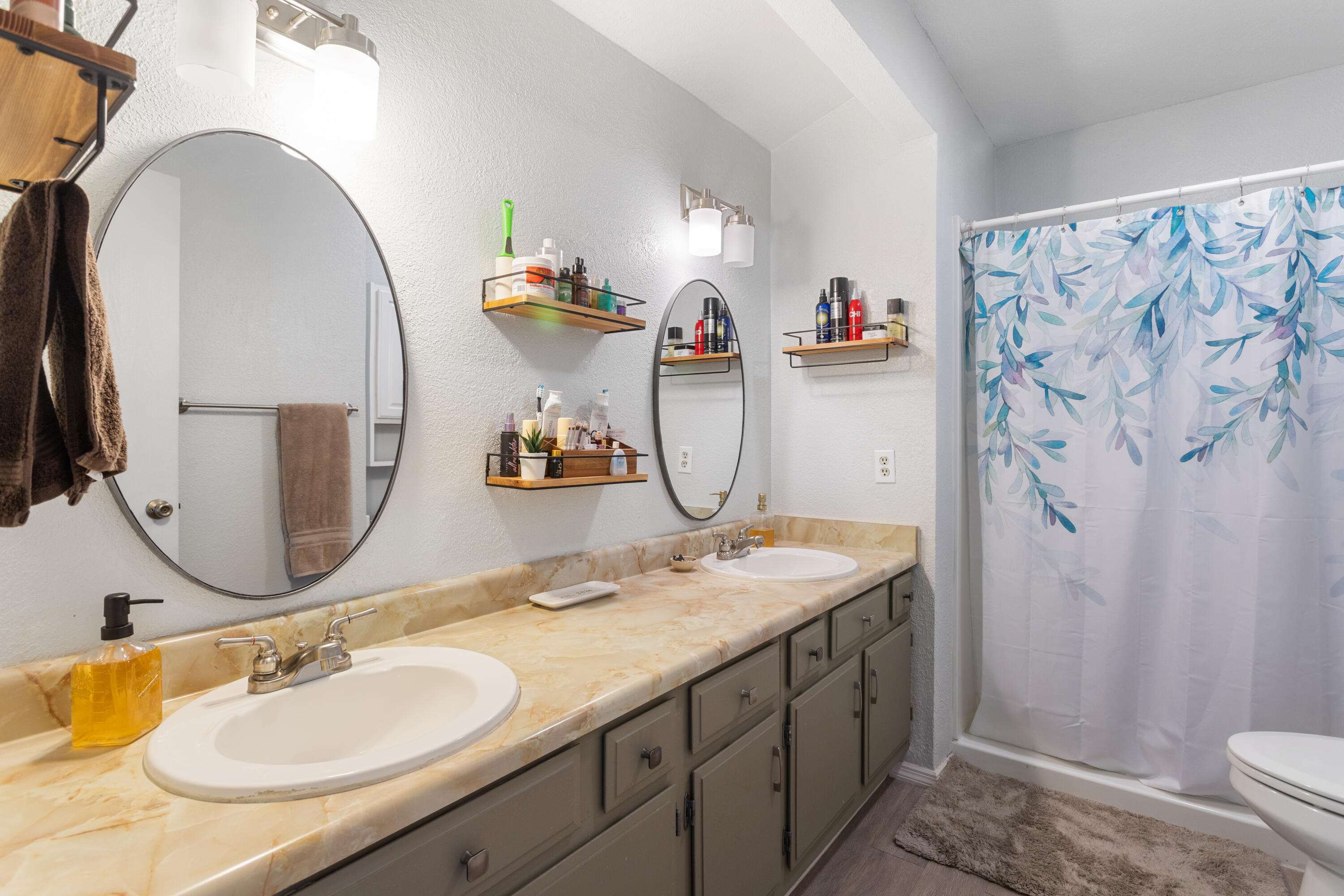 771 Flower Ash Lane Redding, CA 96003 - Photo 18 of 24 a bathroom with a sink double vanity and a mirror