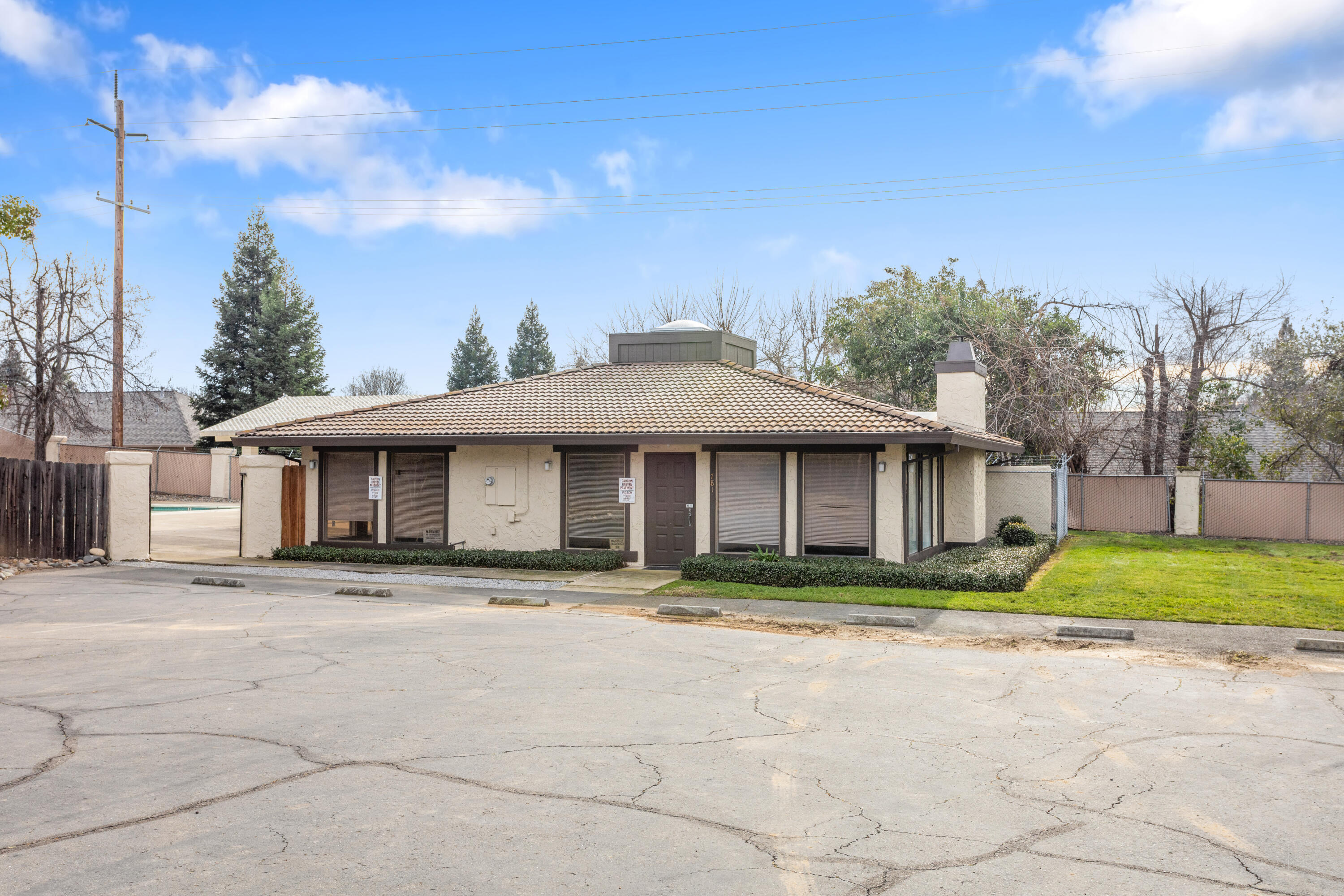 771 Flower Ash Lane Redding, CA 96003 - Photo 23 of 24 a front view of a house with a yard and trees