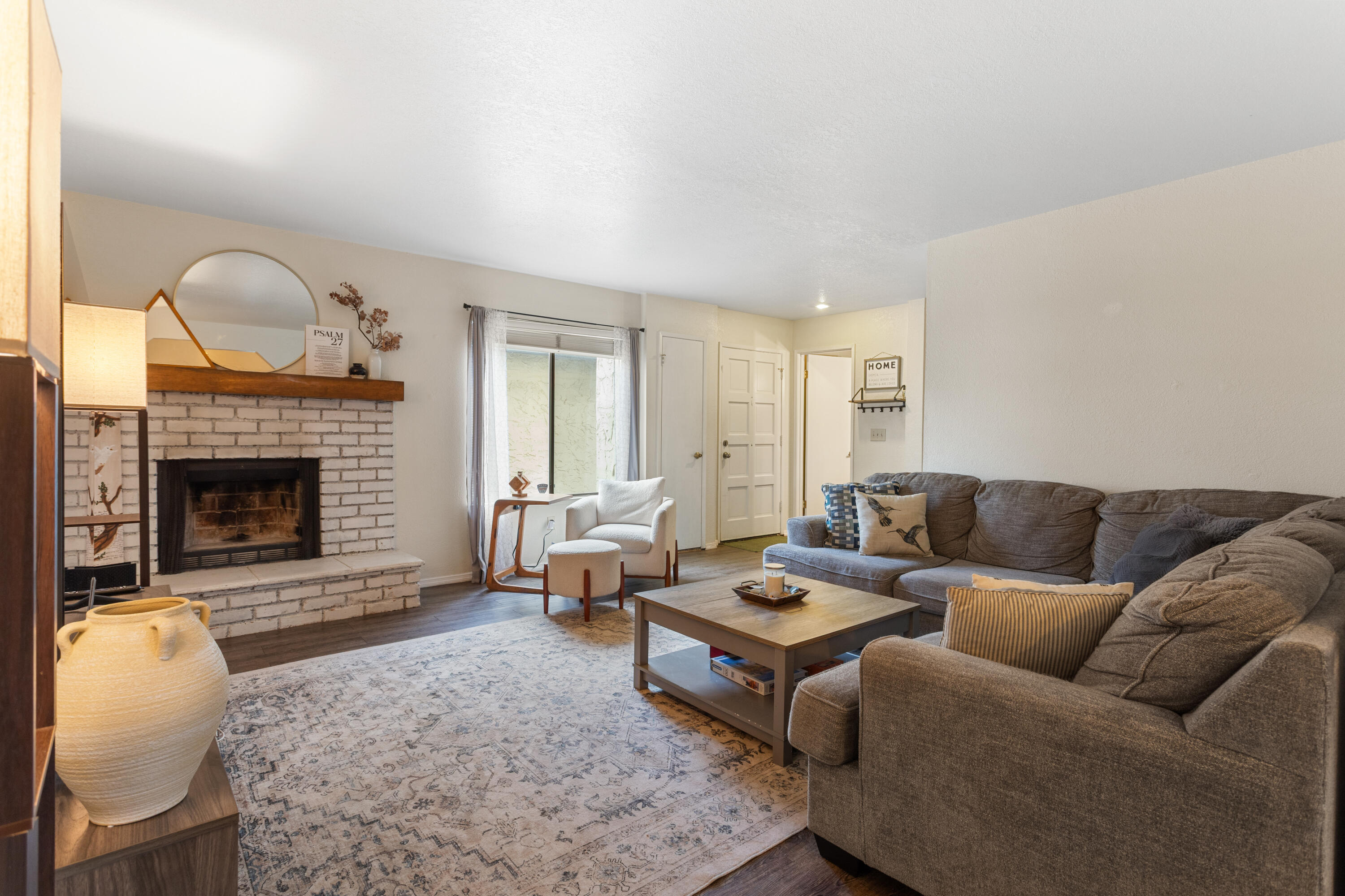 771 Flower Ash Lane Redding, CA 96003 - Photo 8 of 24 a living room with furniture windows and a fireplace
