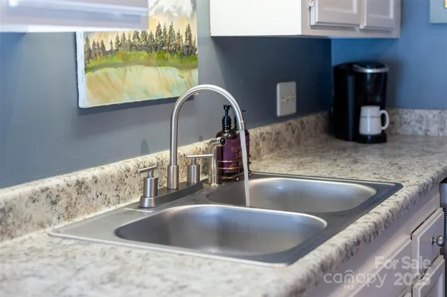 a view of a sink and window in a room