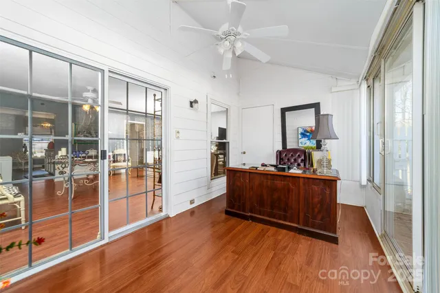 a view of a living room and hardwood floor