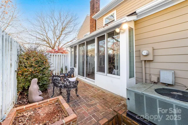 a balcony with table and chairs