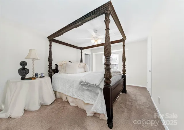 a bed room with a bed and a window