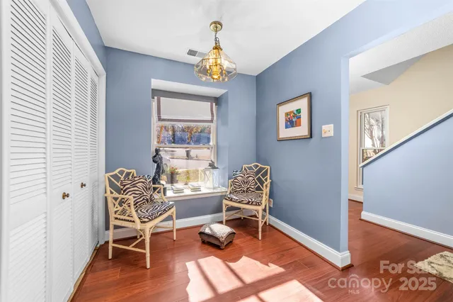 a work room with furniture and windows