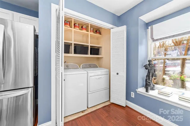 a storage room with wooden floor and window