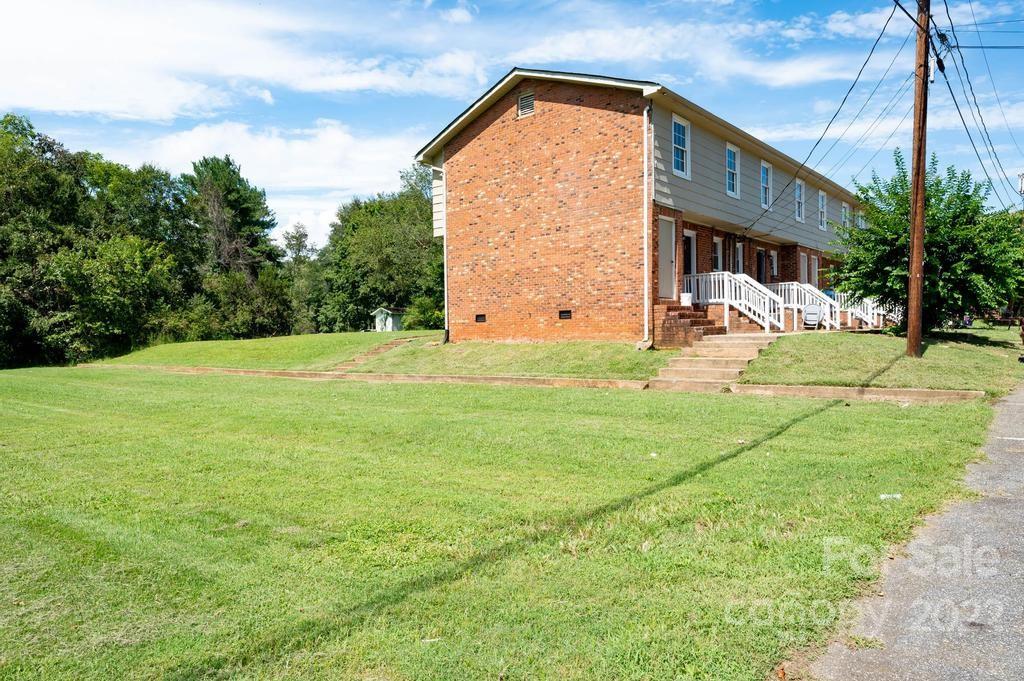 1219 County Home Road Conover, NC 28613 - Photo 12 of 48 a view of a house with backyard and sitting area