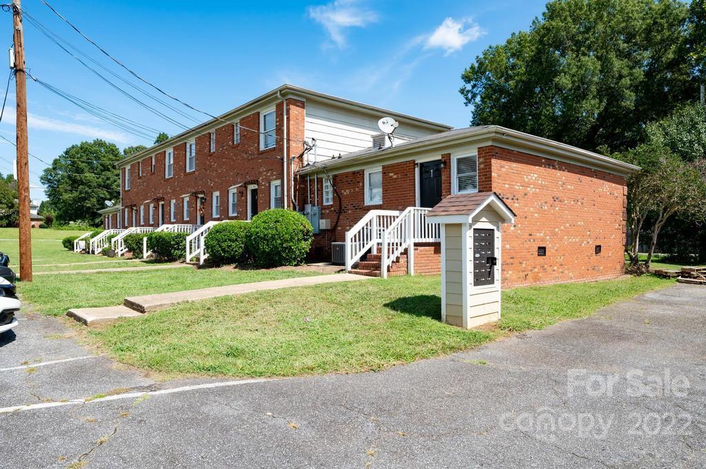 1219 County Home Road Conover, NC 28613 - Photo 13 of 48 a front view of a house with a yard