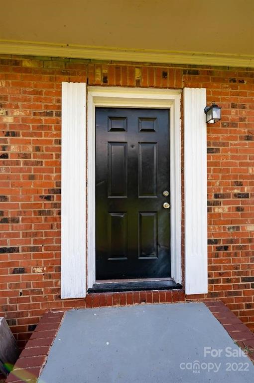 1219 County Home Road Conover, NC 28613 - Photo 15 of 48 a view of a door and wooden floor