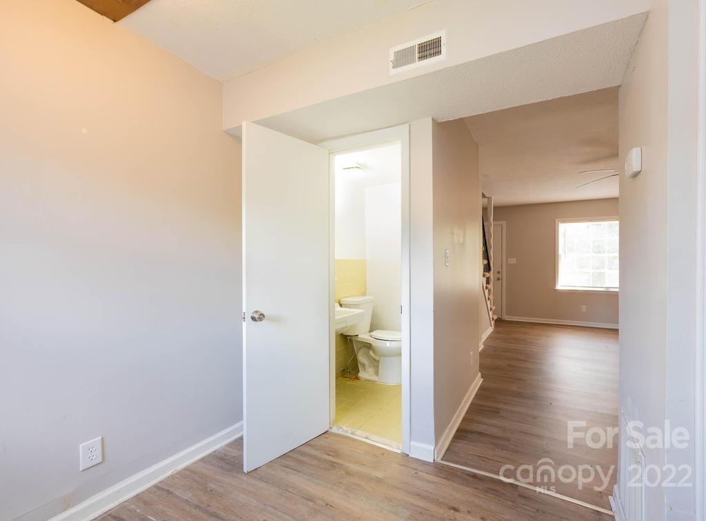 1219 County Home Road Conover, NC 28613 - Photo 26 of 48 a view of a hallway with wooden floor