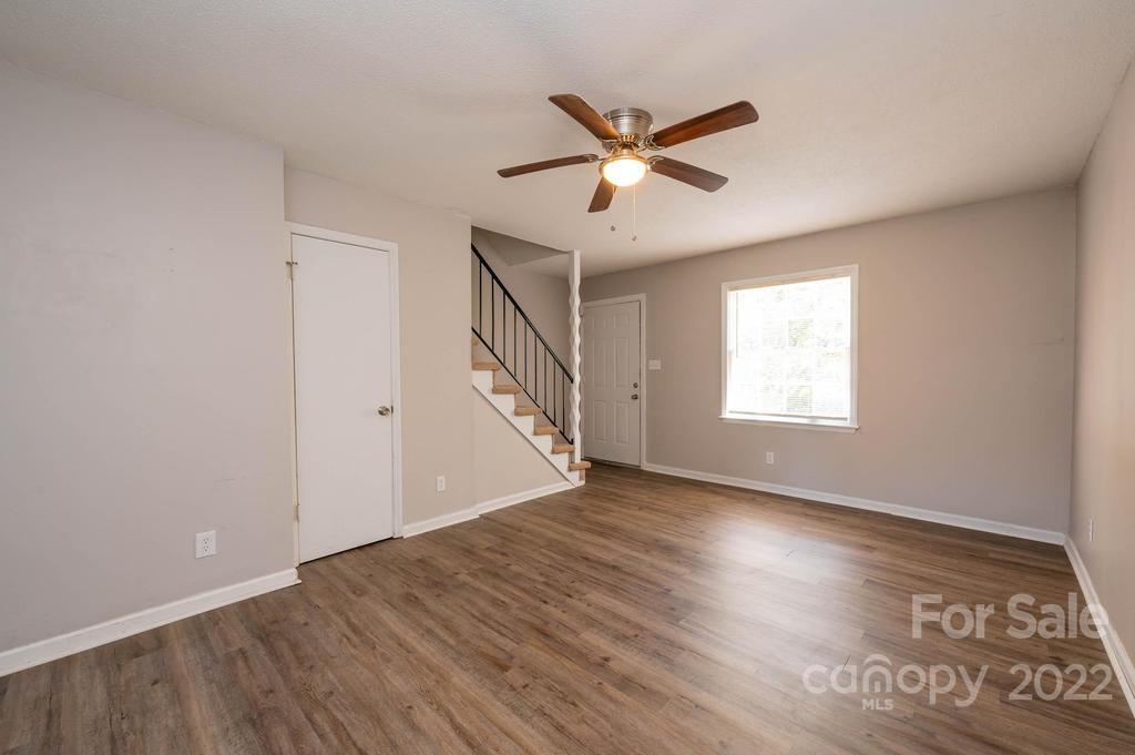 1219 County Home Road Conover, NC 28613 - Photo 28 of 48 a view of empty room with wooden floor and fan