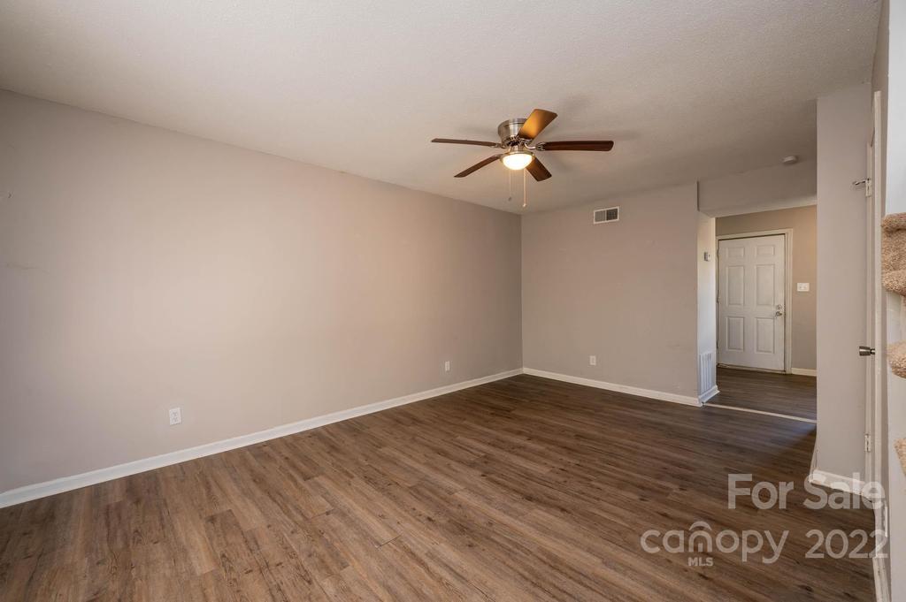 1219 County Home Road Conover, NC 28613 - Photo 30 of 48 a view of empty room with wooden floor