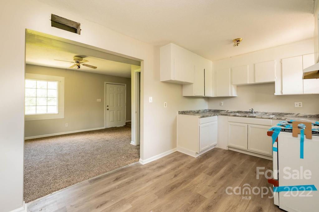 1219 County Home Road Conover, NC 28613 - Photo 35 of 48 a view of a kitchen with a sink and cabinets