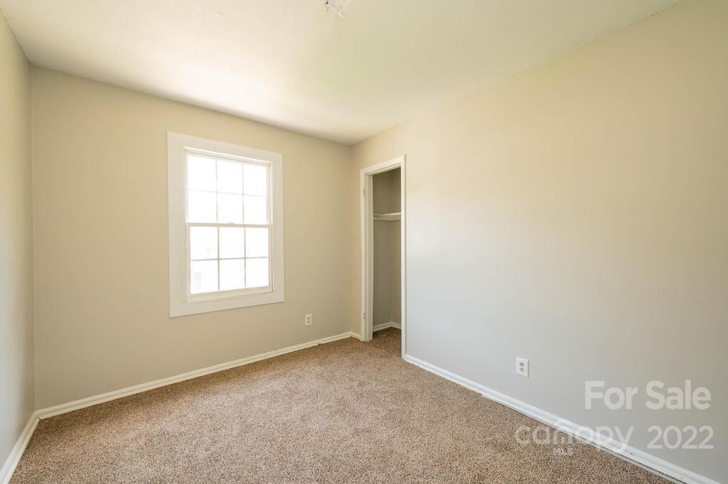 1219 County Home Road Conover, NC 28613 - Photo 41 of 48 an empty room with windows