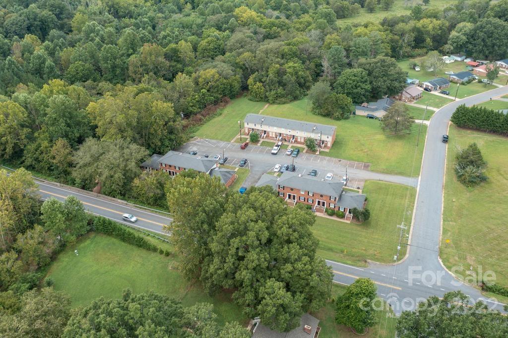 1219 County Home Road Conover, NC 28613 - Photo 44 of 48 an aerial view of a house with outdoor space swimming pool and mountains