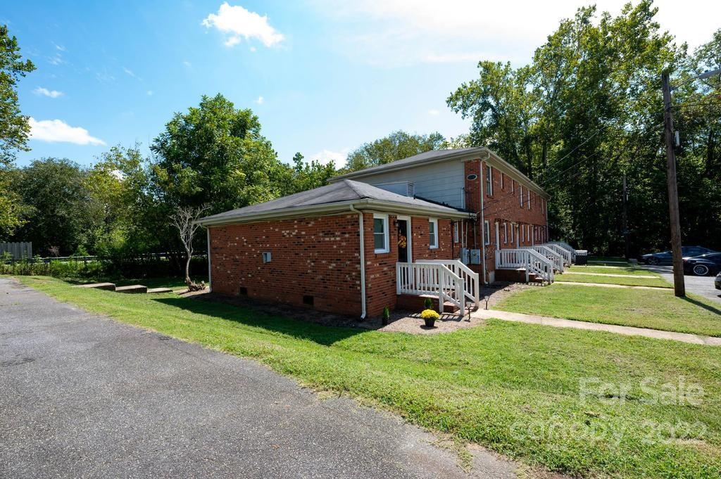 1219 County Home Road Conover, NC 28613 - Photo 10 of 48 a view of a house with backyard and sitting area
