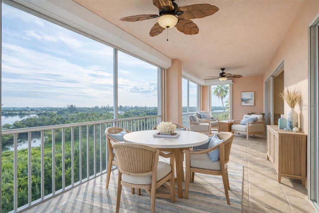 13113 Gasparilla Road, Unit 403 Placida, FL 33946 - Photo 37 of 62 a view of a dining room with furniture window and wooden floor