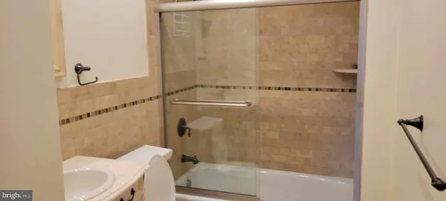 a bathroom with a shower and toilet