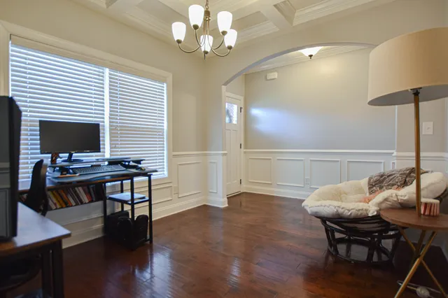 a view of a dining room with furniture and wooden floor