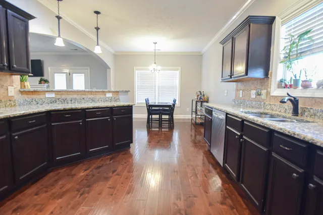a kitchen with lots of counter top space and dining table
