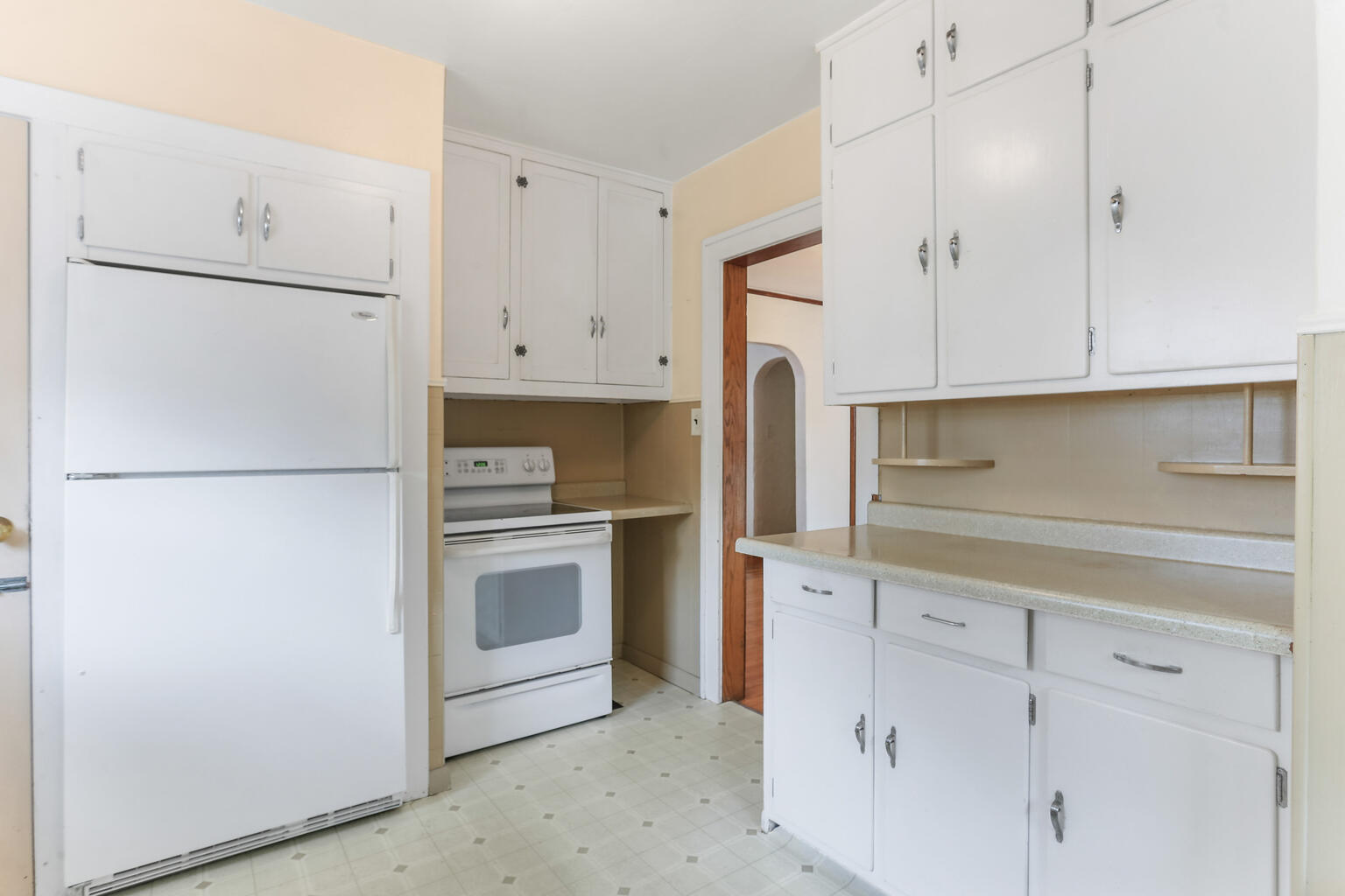 1206 West Healey Street Champaign, IL 61821 - Photo 15 of 42 a kitchen with white cabinets and white appliances