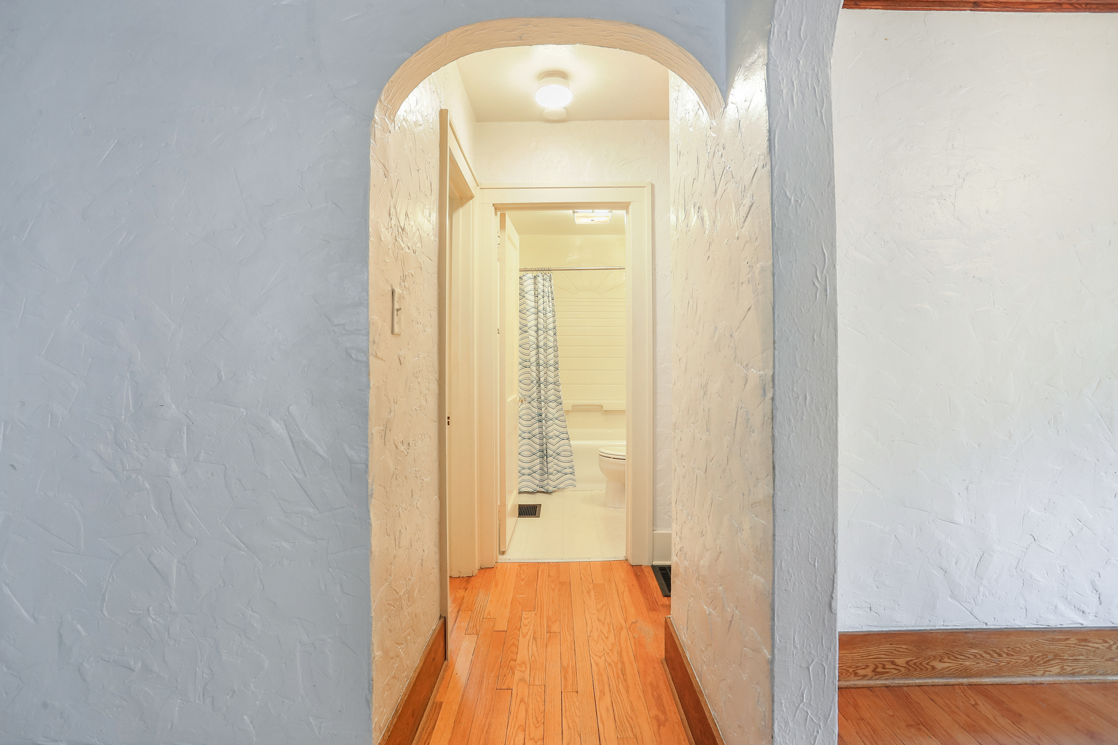 1206 West Healey Street Champaign, IL 61821 - Photo 17 of 42 a view of a hallway with wooden floor