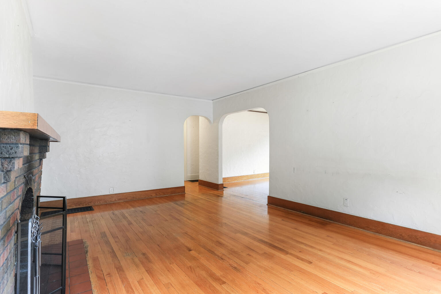 1206 West Healey Street Champaign, IL 61821 - Photo 8 of 42 an empty room with wooden floor and windows