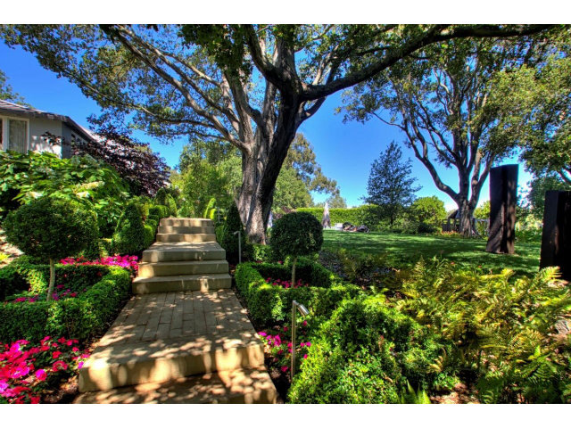 140 Eleanor Drive Woodside, CA 94062 - Photo 6 of 18 a view of a garden with plants and large trees