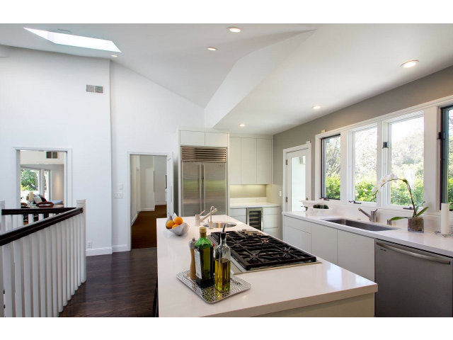 140 Eleanor Drive Woodside, CA 94062 - Photo 7 of 18 a kitchen with stainless steel appliances kitchen island granite countertop a sink stove and refrigerator