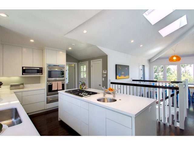 140 Eleanor Drive Woodside, CA 94062 - Photo 8 of 18 a kitchen that has a lot of cabinets a sink and appliances