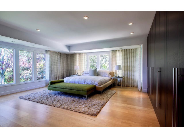 140 Eleanor Drive Woodside, CA 94062 - Photo 9 of 18 a spacious bedroom with a bed and large windows