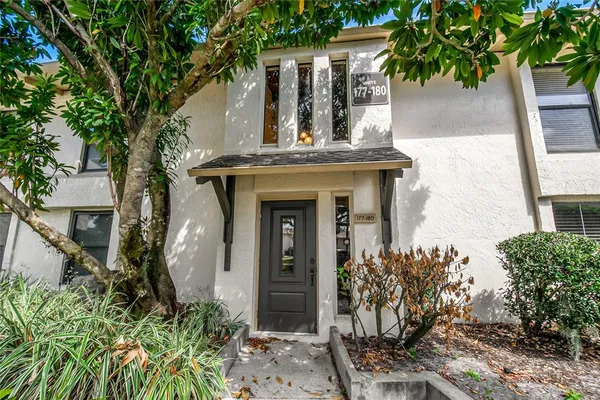 front view of a house with a potted plant