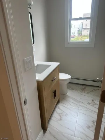 a bathroom with a sink and toilet