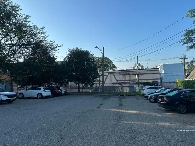 a view of street with parked cars