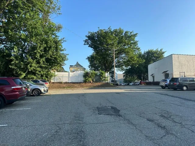 a view of street with parked cars