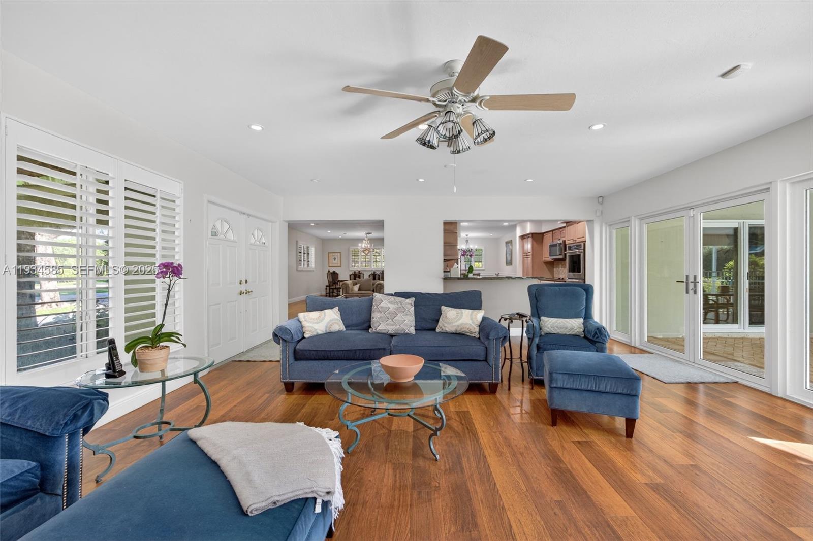 7300 Southwest 116th Terrace Pinecrest, FL 33156 - Photo 15 of 63 a living room with furniture and wooden floor