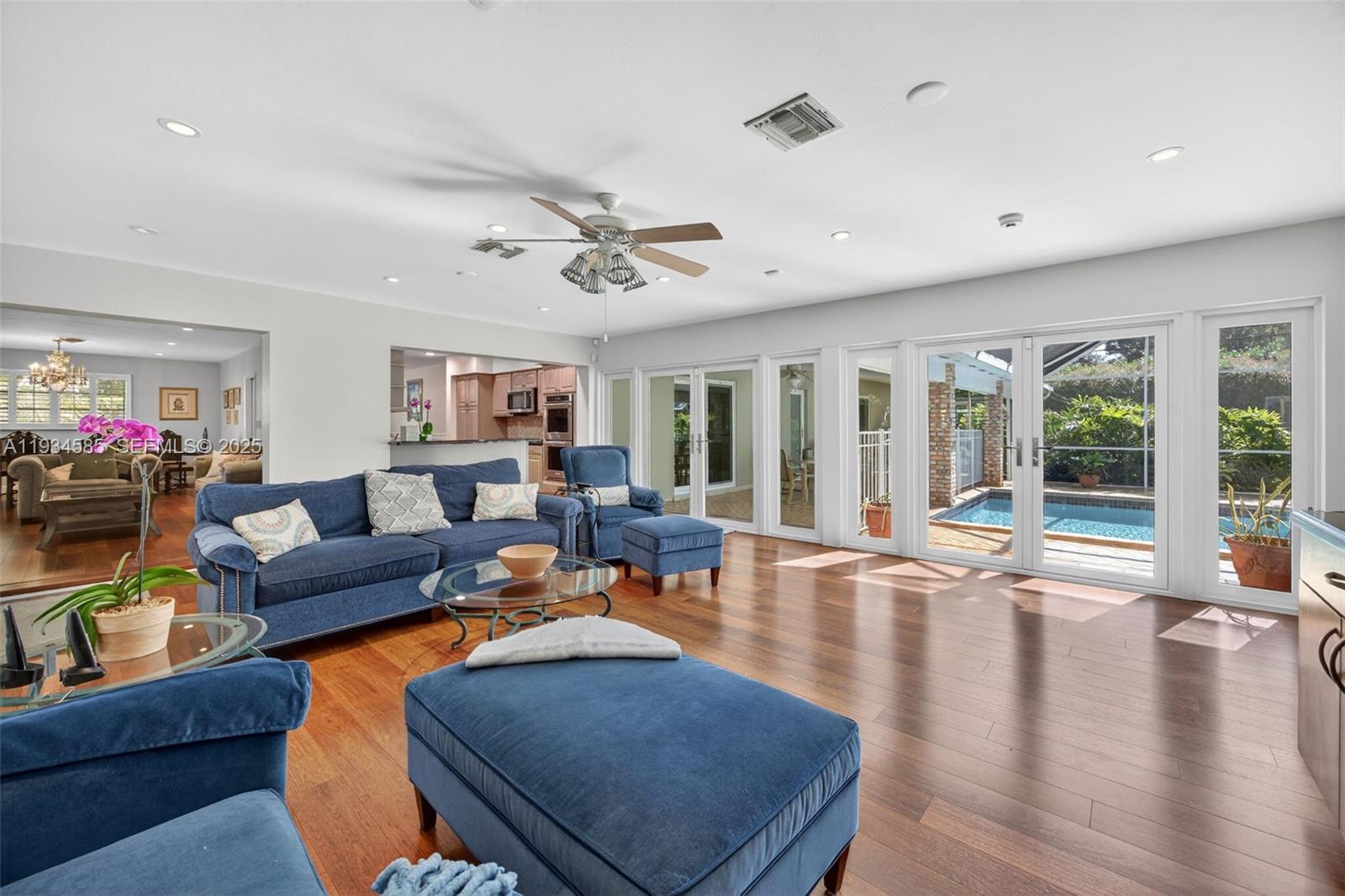 7300 Southwest 116th Terrace Pinecrest, FL 33156 - Photo 16 of 63 a living room with furniture and a large window