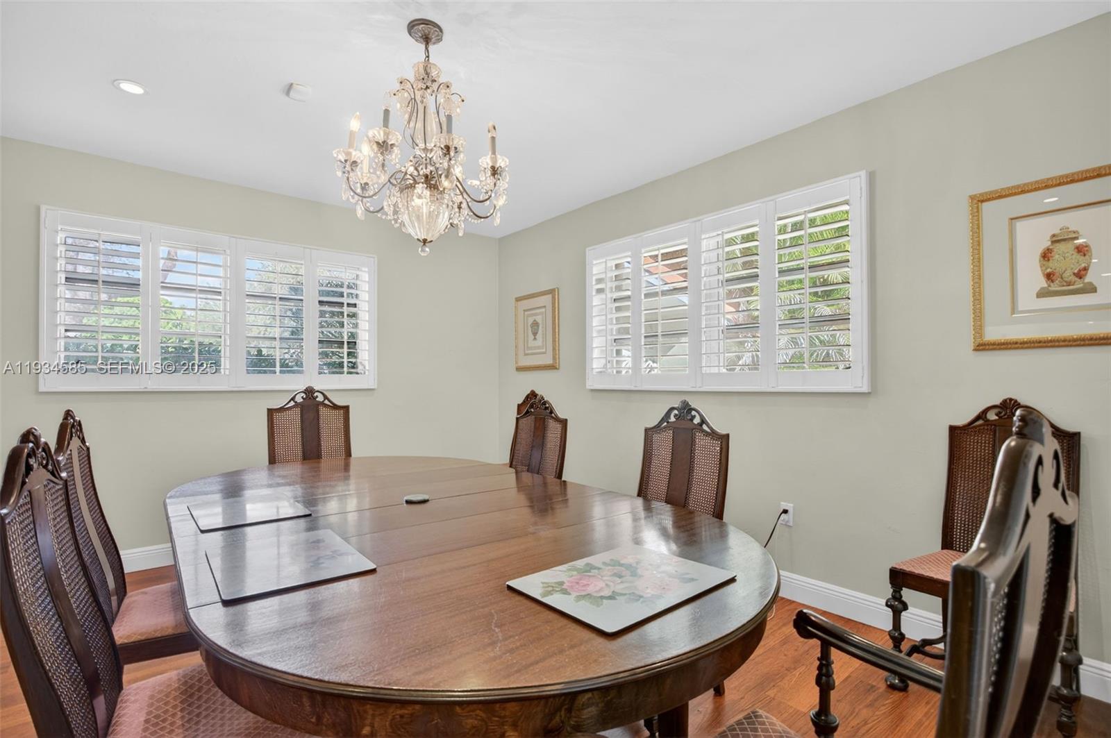 7300 Southwest 116th Terrace Pinecrest, FL 33156 - Photo 23 of 63 a view of a dining room with furniture window and outside view