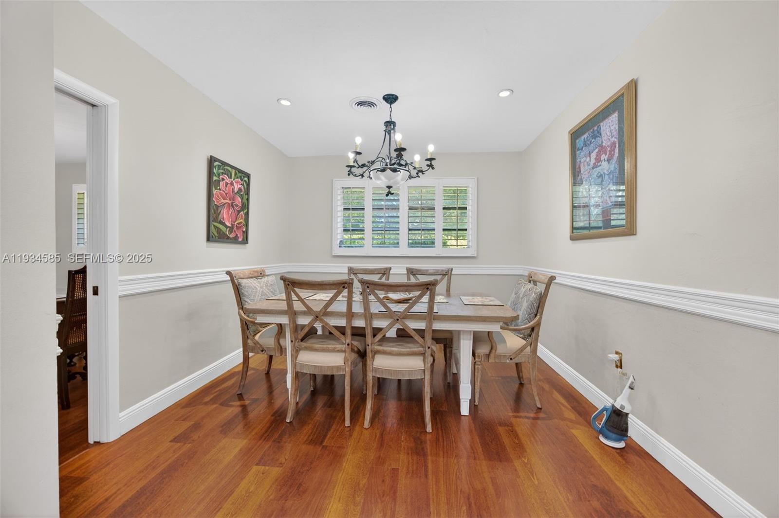 7300 Southwest 116th Terrace Pinecrest, FL 33156 - Photo 4 of 63 a view of a dining room with furniture window and wooden floor