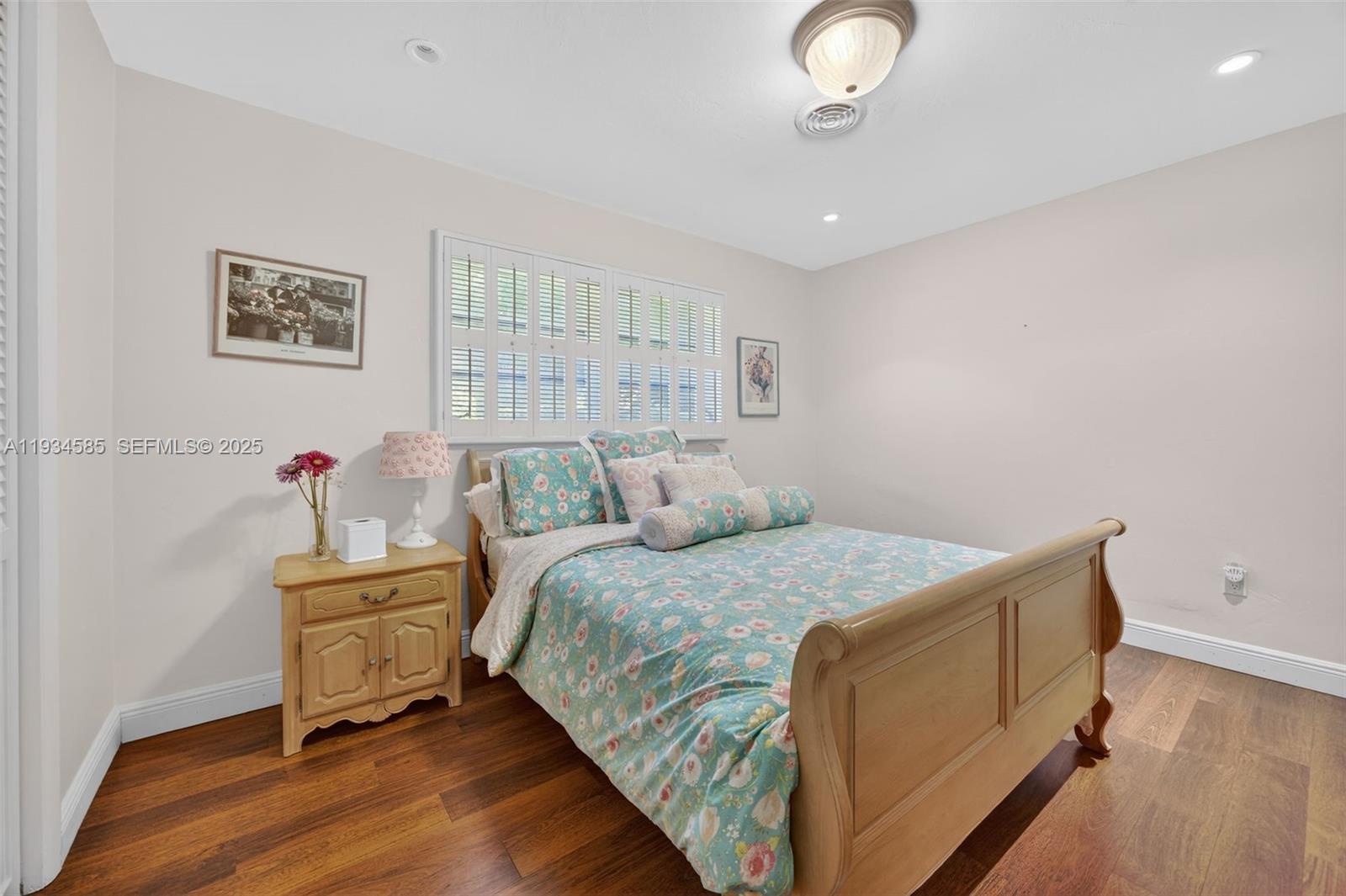 7300 Southwest 116th Terrace Pinecrest, FL 33156 - Photo 41 of 63 a bed room with a bed and a window