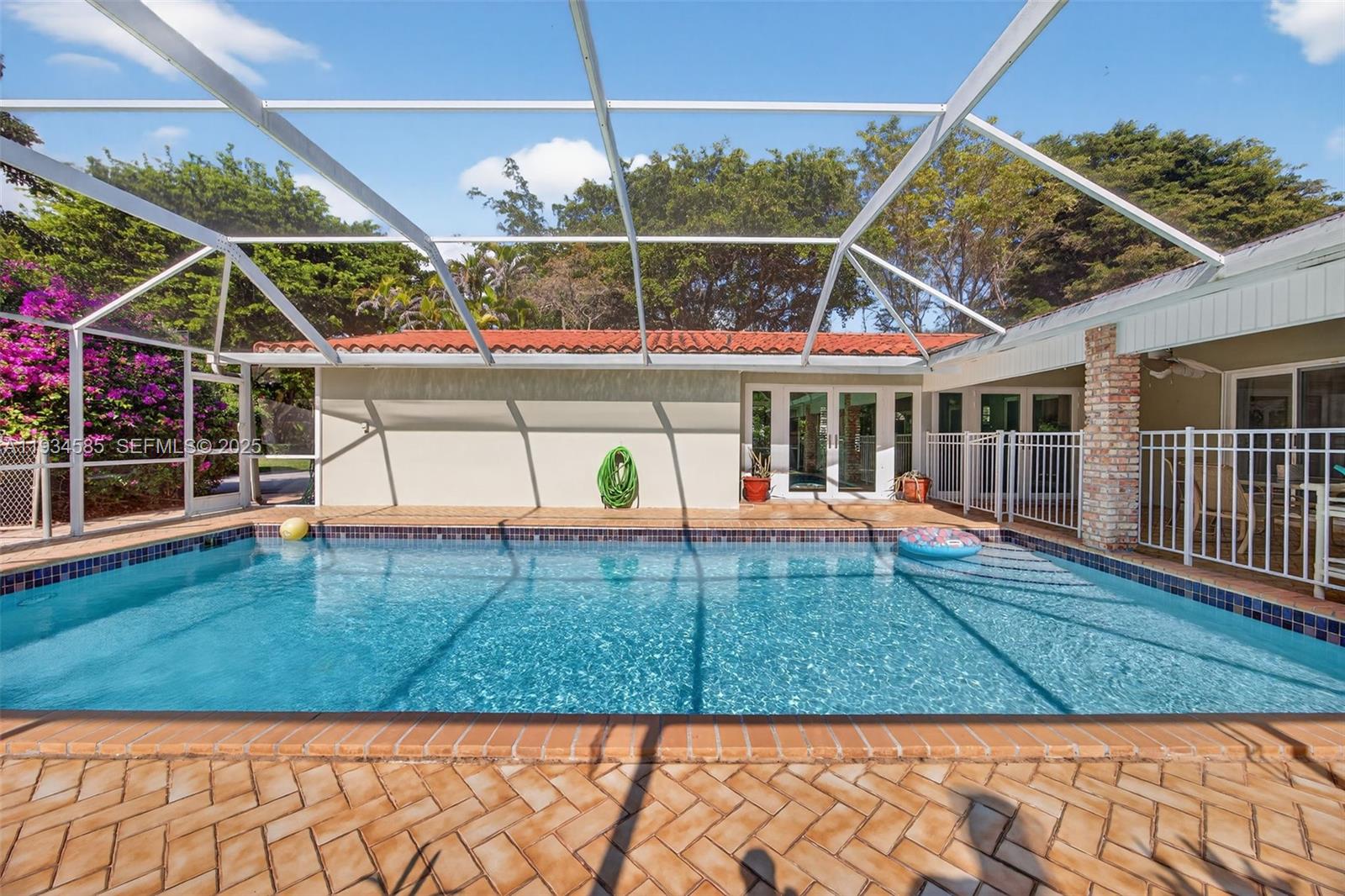 7300 Southwest 116th Terrace Pinecrest, FL 33156 - Photo 52 of 63 a view of a house with backyard and deck