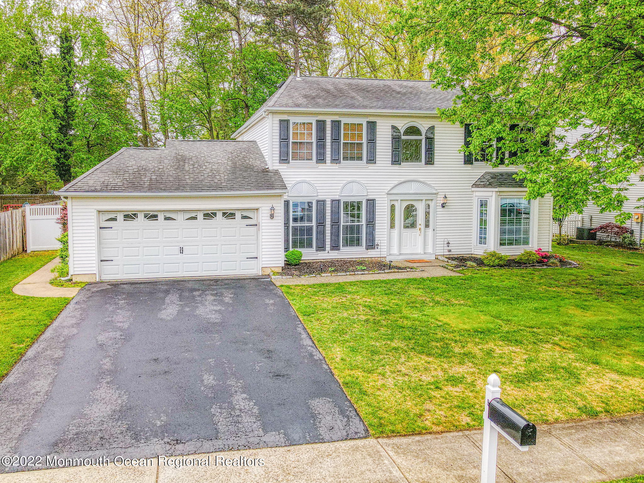 9 Sweet Gum Road Howell, NJ 07731 - Photo 1 of 38 a front view of a house with garden