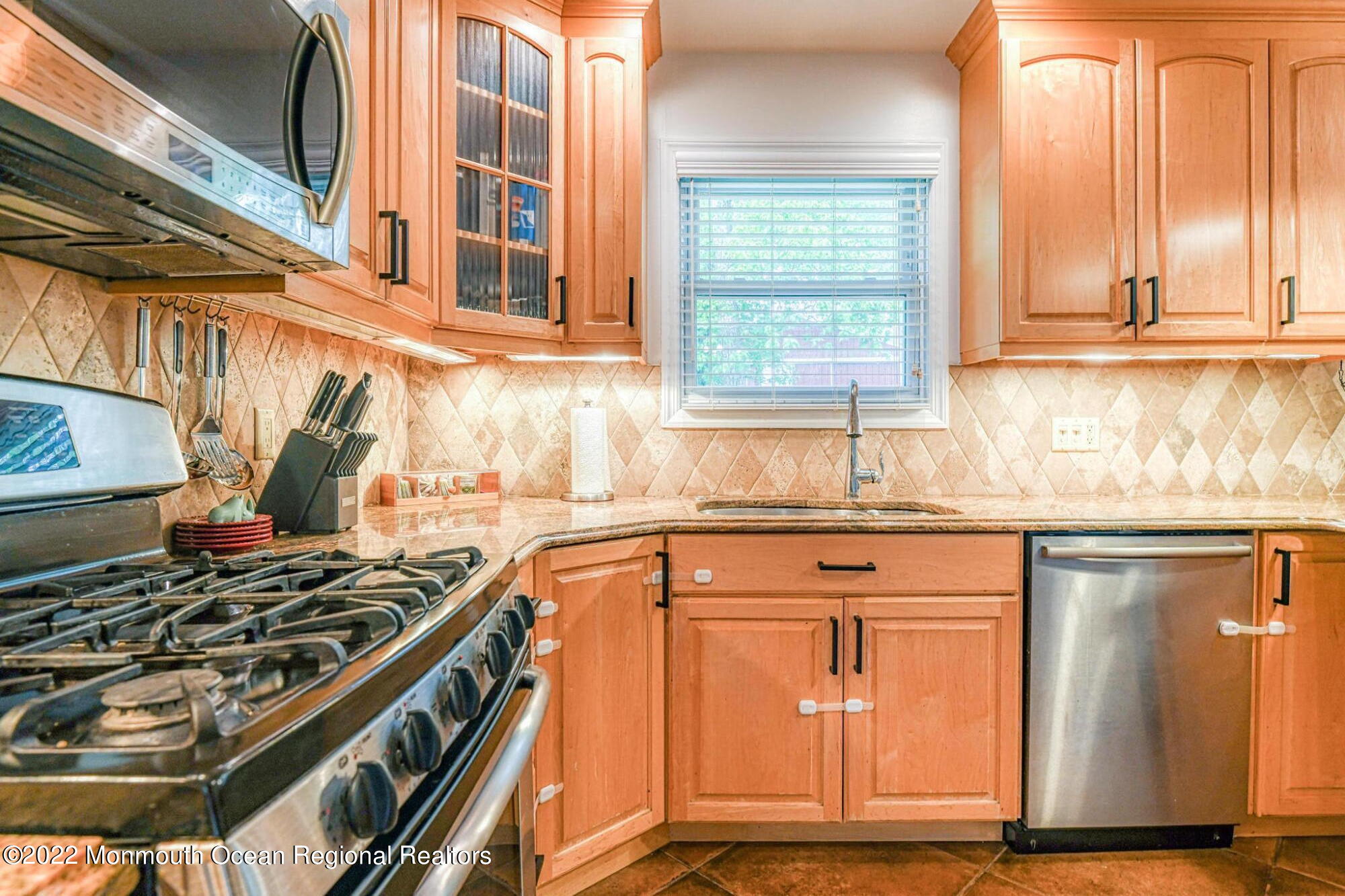 9 Sweet Gum Road Howell, NJ 07731 - Photo 13 of 38 a kitchen with granite countertop a stove and a sink
