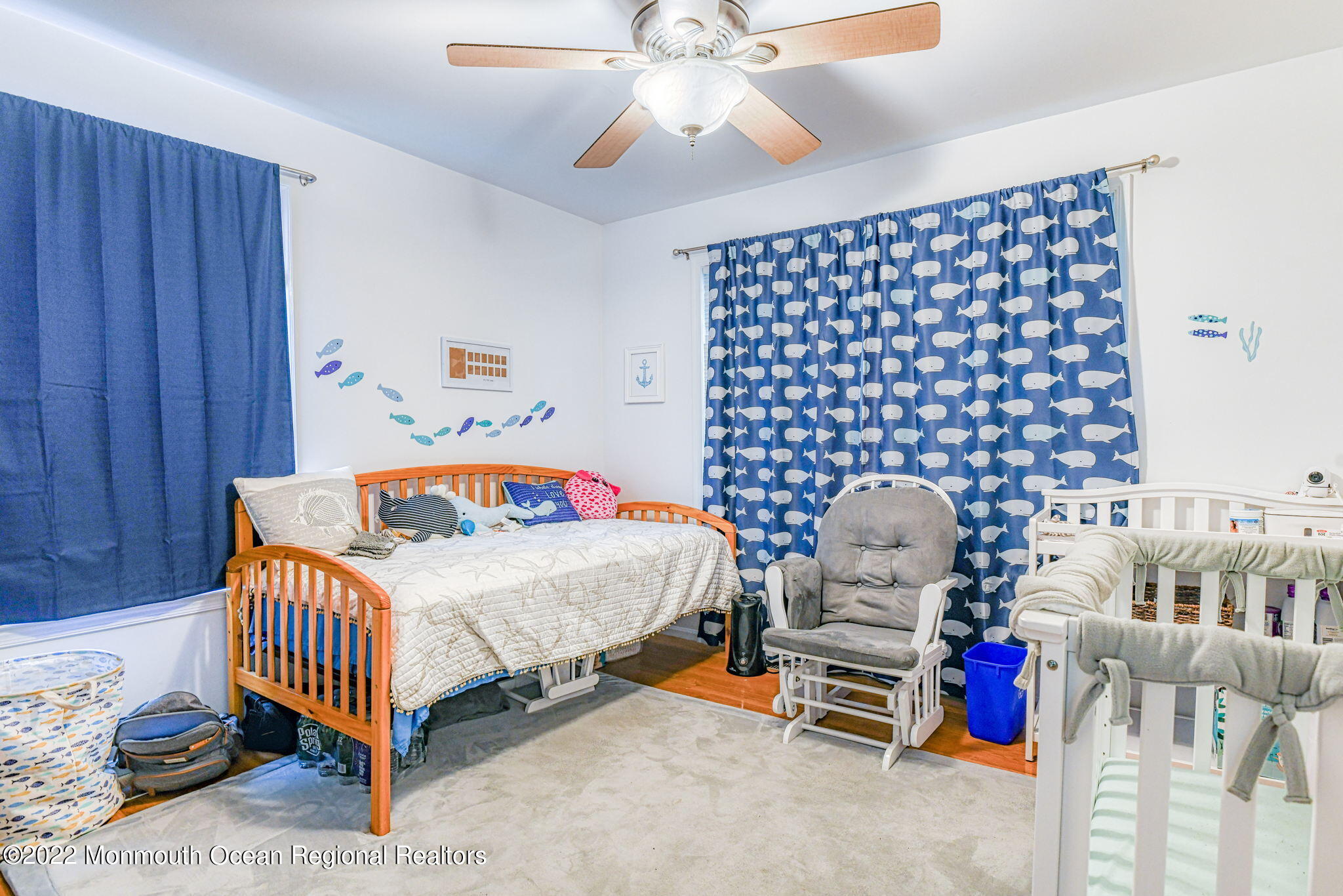 9 Sweet Gum Road Howell, NJ 07731 - Photo 29 of 38 a bedroom with a bed and a chandelier