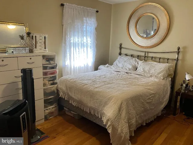 a bedroom with a bed and cabinets