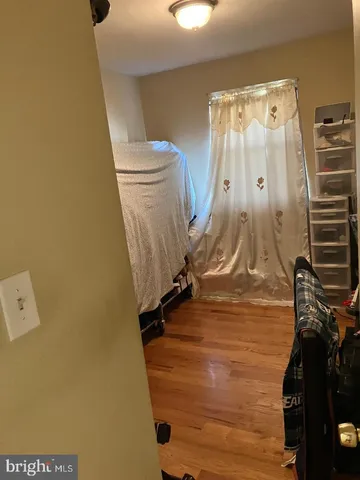 a white toilet sitting next to a shower curtain