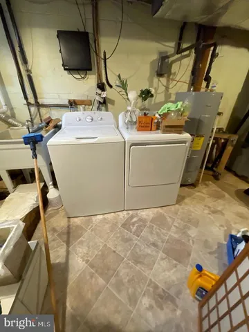 a view of a house with a yard and sitting space