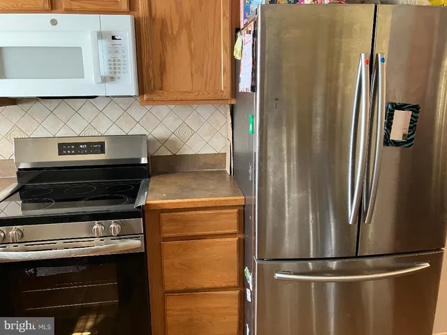 a kitchen with a sink and large window
