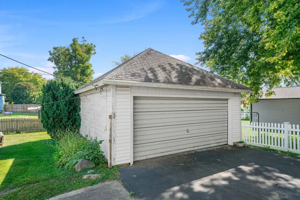 a front view of a house with a yard and a porch