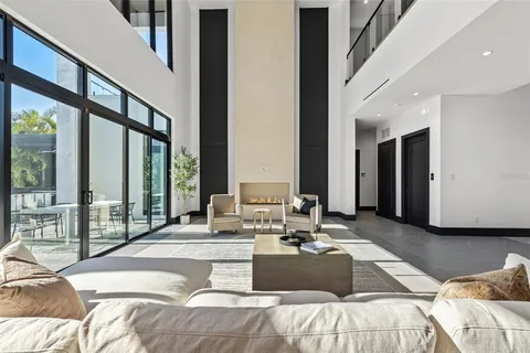 a dinning room with furniture and a window