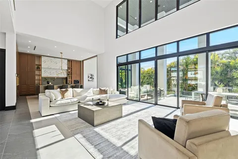 a kitchen with stainless steel appliances a sink stove and cabinets